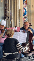 Street musicians perform in Tel Aviv amid scooter traffic