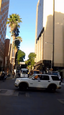 Walking tour through modern Caracas streets and highways