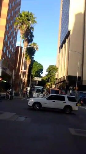 Walking tour through modern Caracas streets and highways