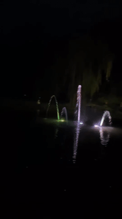 Evening fountains illuminate lake in Targovishte park