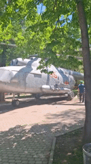 Morning stroll through Almaty park with military displays, rides