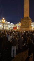 Nighttime crowds gather at Saint Petersburg's Palace Square