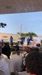 Dance battle performed on outdoor stage in Nigeria