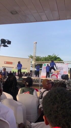Dance battle performed on outdoor stage in Nigeria