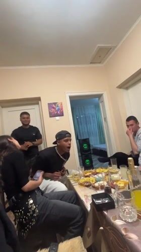Friends gather for casual dinner party in Lozarevo, Bulgaria