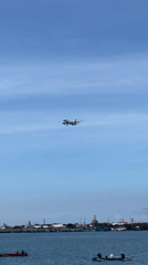 Aircraft descends for landing over Kuta Selatan waters