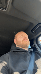 Driver pauses momentarily in car in Chaykovsky, Russia