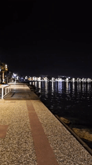Evening walk documented along illuminated Fethiye waterfront promenade