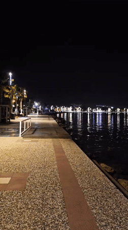 Evening walk documented along illuminated Fethiye waterfront promenade
