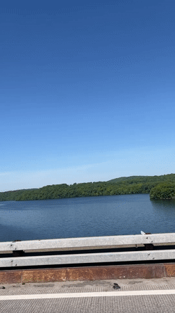 Bridge view captured in Yorktown showing water and hills