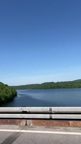 Bridge view captured in Yorktown showing water and hills