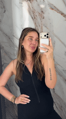 Woman takes bathroom selfie in Moscow marble restroom