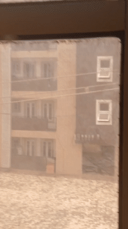 Person documents selfies and courtyard scenes in Lagos building