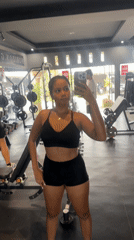 Woman takes mirror selfies at Indonesian gym