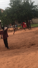 Boys play street football in Nigerian village community
