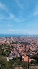 Aerial view captures Barcelona's Sagrada Familia under blue skies