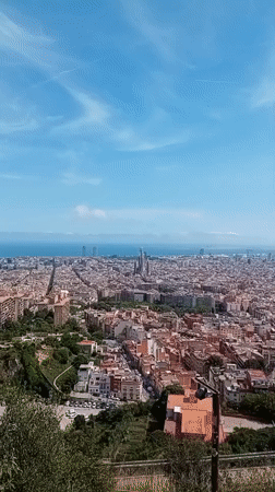 Aerial view captures Barcelona's Sagrada Familia under blue skies