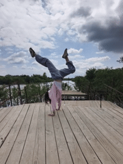Woman performs extended yoga session on Russian pier