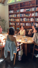 Women share dessert and conversation at Ubud cafe