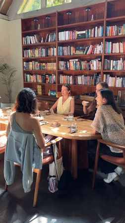 Women share dessert and conversation at Ubud cafe