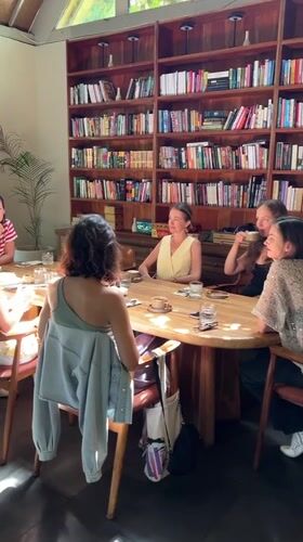 Women share dessert and conversation at Ubud cafe