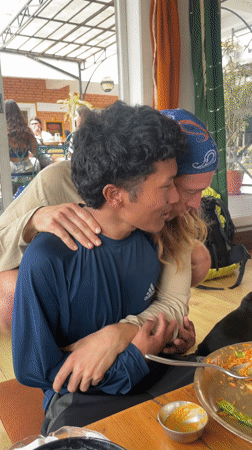 Morning embrace and pet moments captured in Pokhara home