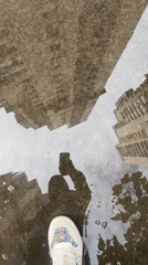 Moscow resident documents rainy morning reflections of city skyscrapers