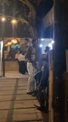 Nighttime outdoor dining scene observed in Abuja