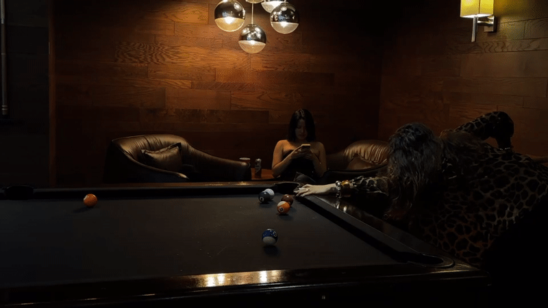 Pool game in a moody Mexico City billiards room