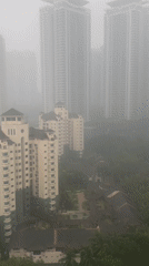 Heavy fog blankets Kuala Lumpur's skyline on a September morning