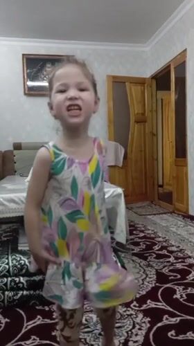 Young girls play and dance in Uzbekistan home