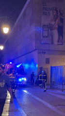 Firefighters respond to a nighttime street incident