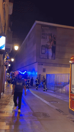 Firefighters respond to a nighttime street incident