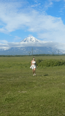 Snow-capped peaks near Krasnyi draw a quick roadside pause