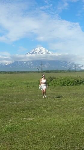 Snow-capped peaks near Krasnyi draw a quick roadside pause