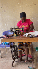 Woman operates vintage sewing machine in Akwanga, Nigeria