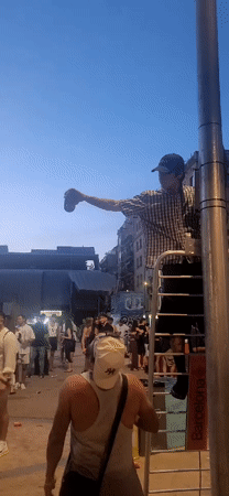 Evening street party with DJ and crowds in Barcelona