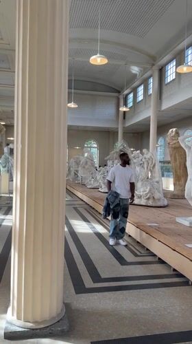 Museum visitor observed in casual attire in Meudon