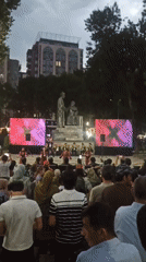 Traditional music and dance at a monument plaza after dark