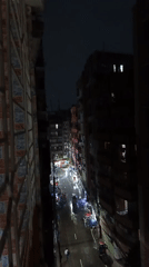 Rainy night street scene captured from multiple elevated viewpoints