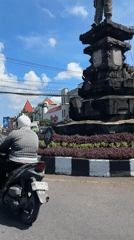 Street traffic flows around Denpasar's Catur Muka roundabout