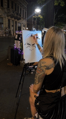 Street caricature session on a Belgrade pedestrian strip at night