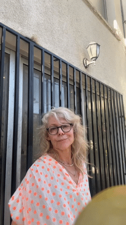 Patio moment in Tel Aviv, bold orange pants and polka dots