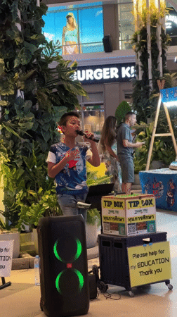 Woman takes selfies indoors in Patong, Thailand