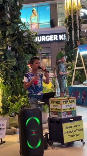 Woman takes selfies indoors in Patong, Thailand
