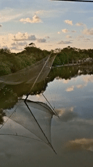 Traditional fishing nets observed in calm Lhokseumawe waters