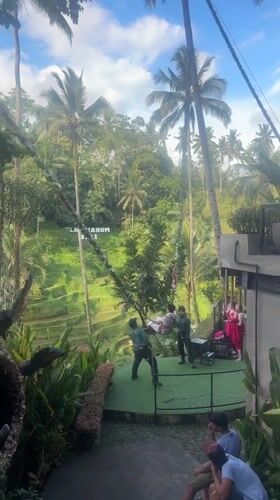 Tourist captures morning view of Tegallalang rice terraces in Bali