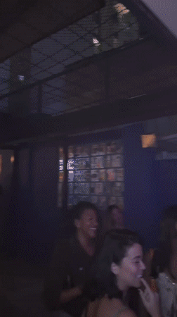 São Paulo bar packed with patrons watching sports, celebrating