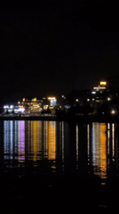 Colorful LED lights illuminate Da Lat waterfront during evening hours