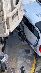 Bus gets stuck under building overhang in Buenos Aires